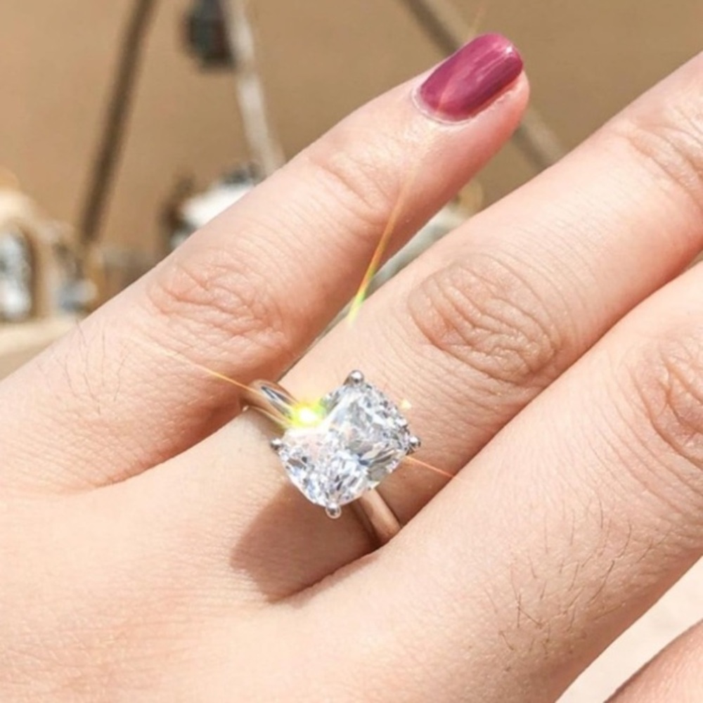 Elongated cushion cut travel engagement ring